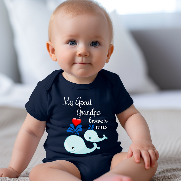 A smiling baby wearing a navy blue t-shirt with a whale graphic and text that says "My Great Grandpa loves me".